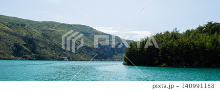 Panoramic Landscape view on green canyon Antalya Turkey with turquoise water mountain cliffs and green forest. Showcasing natural beauty travel tourist destination. Vacation concept 140991188