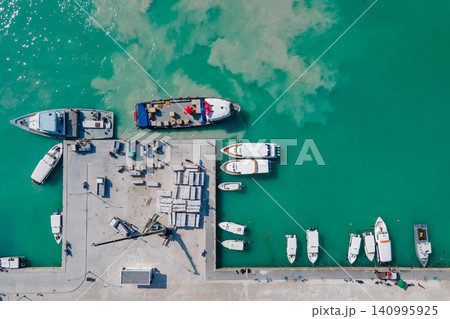 Aerial view of tour boats and logistic boats parking in the jetty at Maafushi island, Maldives 140995925