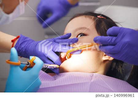 Little Girl Sitting in Dentist Chair Injected With Anesthetic Injection Little Girl Sitting in Dentist Chair Injected With Anesthetic Injection 140996961