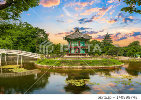 Hyangwonjeong Pavilion at center pond, Gyeongbokgung Palace during a beautiful sunset Hyangwonjeong Pavilion at center pond, Gyeongbokgung Palace during a beautiful sunset 140998748