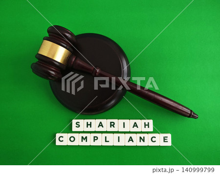 Shariah compliance concept with judge gavel and letter tiles Shariah compliance concept with judge gavel and letter tiles 140999799