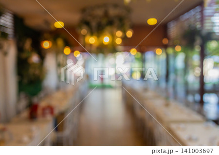 Vintage tone blur image of food stall at night festival with bokeh for background usage. Vintage tone blur image of food stall at night festival with bokeh for background usage. 141003697