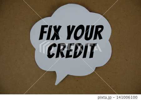 Fix Your Credit text with speech bubble top view on paper craft background Fix Your Credit text with speech bubble top view on paper craft background 141006100