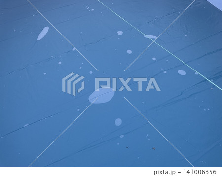 Water condensation texture on pool cover surface 141006356