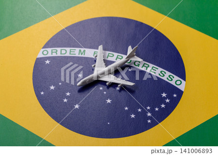 Airplane on the brazil flag as a conceptual backdrop for flights. Airplane on the brazil flag Airplane on the brazil flag as a conceptual backdrop for flights. Airplane on the brazil flag 141006893