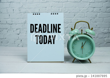 "Deadline Today" Reminder with Mint Green Alarm Clock on white brick wall Background 141007895