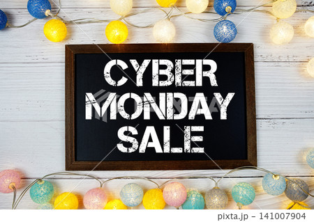 Cyber Monday Sale text with LED cotton balls decoration on wooden background Cyber Monday Sale text with LED cotton balls decoration on wooden background 141007904