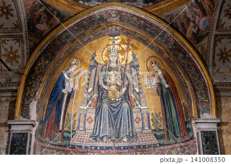 Naples, italy. December 27, 2024. Naples duomo mosaic showing the virgin mary holding baby jesus, flanked by saint januarius and another saint. Gold details covering the artwork in italy 141008350
