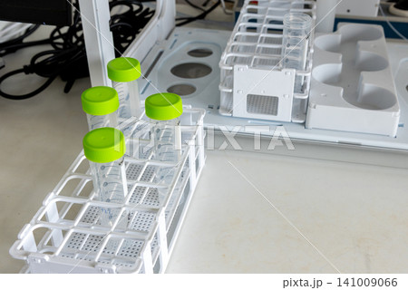 Laboratory sample preparation with test tubes, beaker in analytical laboratory 141009066