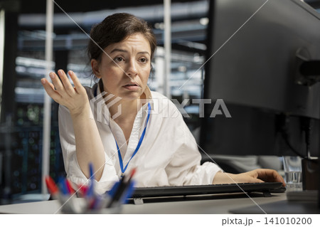 Concerned server hall worker sees error popup on screen while working with software. Concerned server hall worker sees error popup on screen while working with software. 141010200