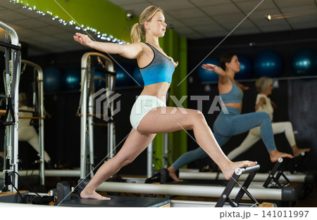 Woman doing leg exercises 141011997
