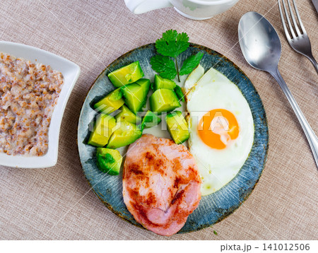 Breakfast: pork, avocado, scrambled eggs and buckwheat Breakfast: pork, avocado, scrambled eggs and buckwheat 141012506