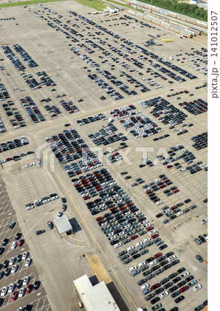 Cars parked ready for sale on automotive factory parking lot 141012507