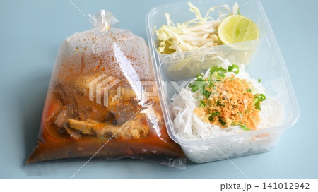 rice vermicelli with northern thai curry sauce in plastic bag 141012942