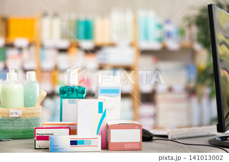 Medicines of European brands, various dosage forms on desktop near computer 141013002