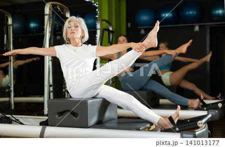 Woman doing exercises in training 141013177