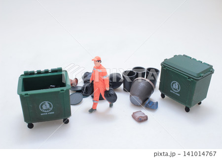 the Miniature workers sorting plastic waste. 141014767
