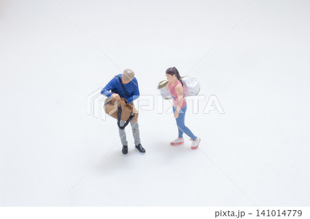 Miniature Travelers With Bags On Minimal Background Miniature Travelers With Bags On Minimal Background 141014779