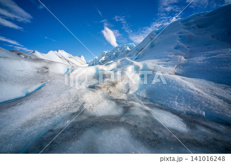 Glacier ice perito moreno glaciers blue crevasse landscape under clear sky with frozen mountain texture Glacier ice perito moreno glaciers blue crevasse landscape under clear sky with frozen mountain texture 141016248