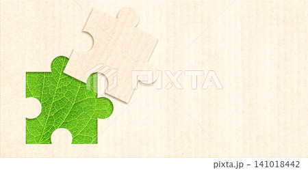 Horizontal banner with part of puzzle from recycled paper and green leaf. Development of strategy approach to zero waste, responsible consumption. Reuse, renewable resource, eco-friendly concept Horizontal banner with part of puzzle from recycled paper and green leaf. Development of strategy approach to zero waste, responsible consumption. Reuse, renewable resource, eco-friendly concept 141018442