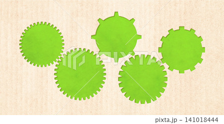 Part of gear from recycled paper, connected together. Development of strategy approach to zero waste. Renewable resource, eco-friendly concept. Reuse, eco-friendly design, and impact of team success 141018444