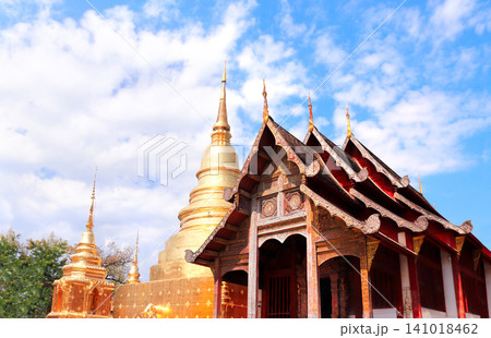 Golden stupa and wooden pavilion in Wat Chedi Luang Temple complex, Chiang Mai, Thailand. Wat Chedi Luang is a Buddhist temple in historic center of Chiang Mai. Topic of vacation, travel, trip, tour 141018462