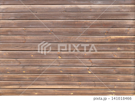 Texture of old wooden board of brown color. Horizontal or vertical background with weathered retro wood planks. Wall with pine boards trim. Texture of an aged wooden panels, its hue a deep brown Texture of old wooden board of brown color. Horizontal or vertical background with weathered retro wood planks. Wall with pine boards trim. Texture of an aged wooden panels, its hue a deep brown 141018466
