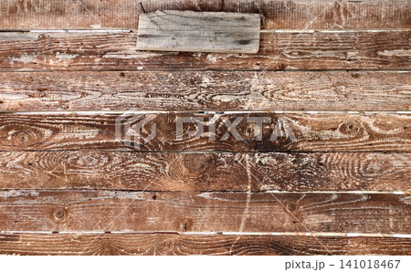 Texture of old wooden board of brown color. Horizontal or vertical background with weathered retro wood planks. Wall with pine boards trim. Texture of an aged wooden panels, its hue a deep brown 141018467