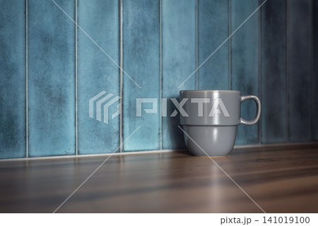 Gray ceramic mug on wooden countertop with blue tile kitchen backsplash Gray ceramic mug on wooden countertop with blue tile kitchen backsplash 141019100