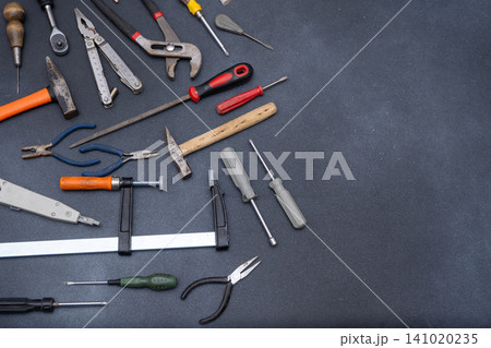 Hand Tools set top view. Professional DIY different Equipment for household. Assorted work and home renovation tool flat lay copy space Hand Tools set top view. Professional DIY different Equipment for household. Assorted work and home renovation tool flat lay copy space 141020235