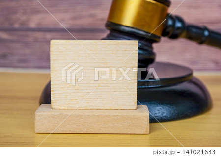 lack Wooden Gavel with Blank Square Sign Board for text on Wood Table Legal Concept lack Wooden Gavel with Blank Square Sign Board for text on Wood Table Legal Concept 141021633