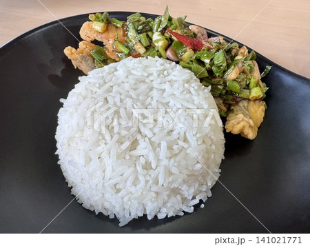 Crispy Fried Sea Bass with Spicy Thai Salad (Yum Pla Krapong) Served on Steamed Rice Crispy Fried Sea Bass with Spicy Thai Salad (Yum Pla Krapong) Served on Steamed Rice 141021771