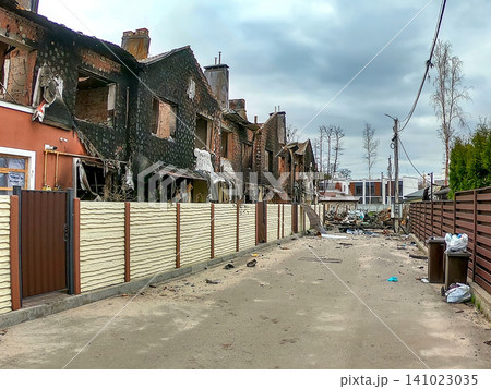 Destruction seen on a street with burned buildings in a neighborhood after a recent fire incident in the area Destruction seen on a street with burned buildings in a neighborhood after a recent fire incident in the area 141023035