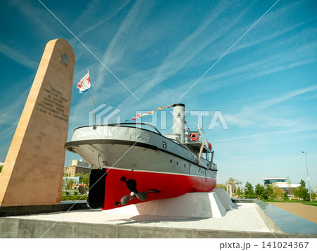 Volgograd river embankment with historic ship monument and memorial stele, Russia 141024367