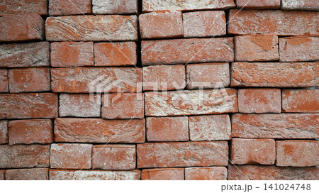 Full frame texture of stacked rustic red clay bricks 141024748