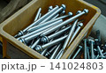 Steel wedge anchor bolts in a plastic box close up 141024803