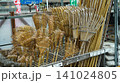 Traditional bamboo lawn rakes for sale at a store 141024805