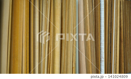 Vertical samples of thin wood veneer sheets and boards 141024809