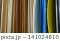 Vertical samples of wooden veneers and colorful plastic sheets 141024810