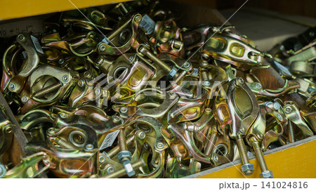 Zinc plated steel scaffolding clamps in a storage box Zinc plated steel scaffolding clamps in a storage box 141024816
