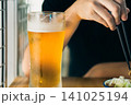 飲みかけのグラスビール	 141025194