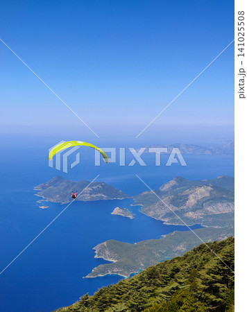 beautiful landscape with a view of the sea flying on a paraglider beautiful landscape with a view of the sea flying on a paraglider 141025508