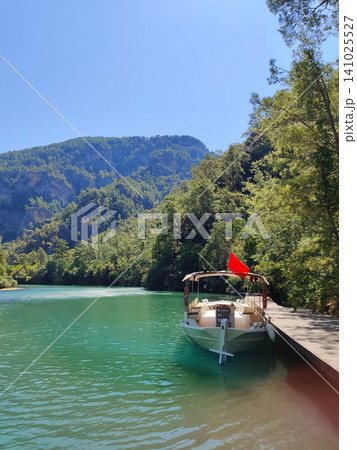 beautiful ships and boats are moored near the shore 141025527