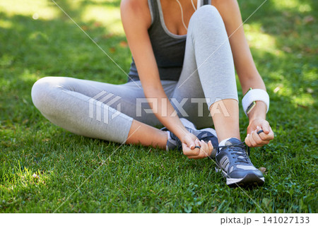 Sneakers, hands and tie shoelace on grass, ready for run or cardio for fitness and sports outdoor. Exercise, workout and person with shoes in park for training, health and wellness with runner Sneakers, hands and tie shoelace on grass, ready for run or cardio for fitness and sports outdoor. Exercise, workout and person with shoes in park for training, health and wellness with runner 141027133