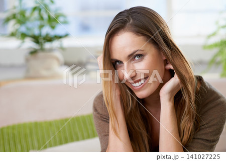 Woman, relax and happiness in portrait on sofa in apartment on holiday or vacation in home. Girl, rest and smile on couch in living room with energy for weekend, break and excited for free time 141027225