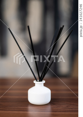 incense sticks in a vase on the table incense sticks in a vase on the table 141027246