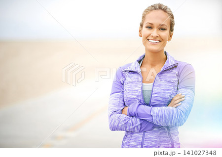 Beach, portrait or woman with arms crossed for training, exercise or fitness workout in promenade. Confident, happy or sports athlete with smile ready to start practice at sea for wellness or running Beach, portrait or woman with arms crossed for training, exercise or fitness workout in promenade. Confident, happy or sports athlete with smile ready to start practice at sea for wellness or running 141027348