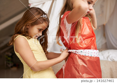 Girls, play or friendship in childhood, game or dress up as silly, bonding or together in bedroom. Best friends, happy or help as carefree, playful or goofy kids for fun, leisure and recreation Girls, play or friendship in childhood, game or dress up as silly, bonding or together in bedroom. Best friends, happy or help as carefree, playful or goofy kids for fun, leisure and recreation 141027461