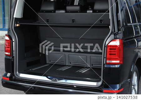 Modern car with open empty trunk outdoors Modern car with open empty trunk outdoors 141027538
