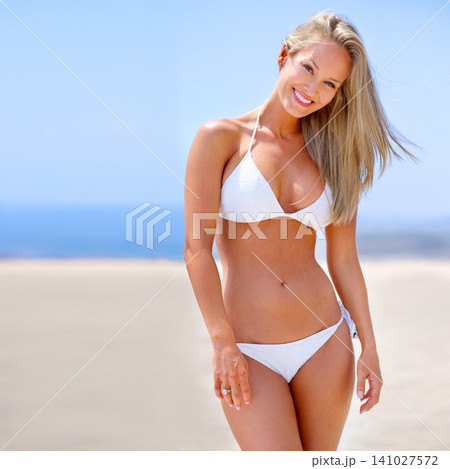 Summer, beach and portrait of woman in bikini on vacation, adventure or holiday for travel. Smile, excited and young female person in swimwear on tropical weekend trip by ocean or sea in Australia. Summer, beach and portrait of woman in bikini on vacation, adventure or holiday for travel. Smile, excited and young female person in swimwear on tropical weekend trip by ocean or sea in Australia. 141027572